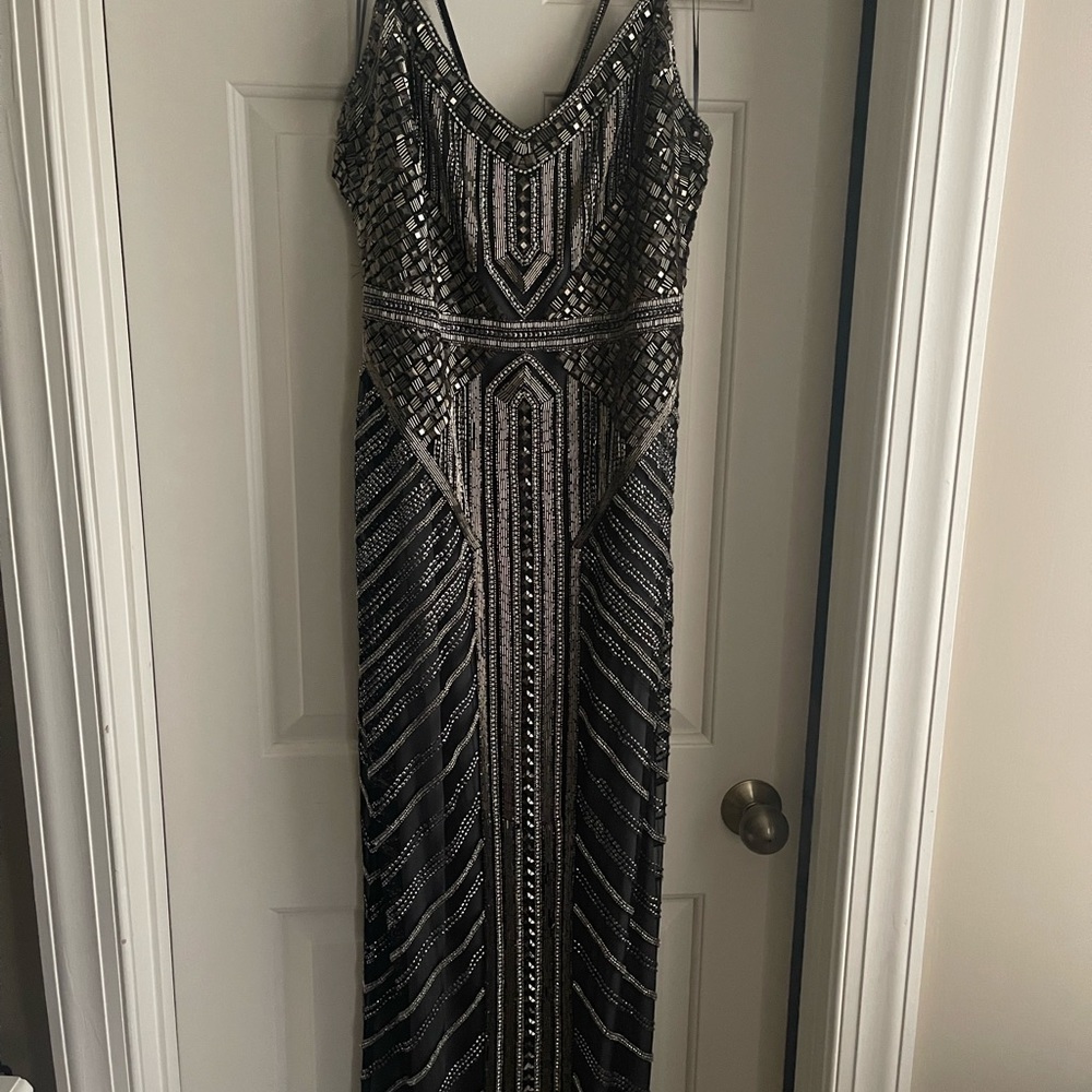 Theia gunmetal formal gown. A few beads missing on hem but in good condition.